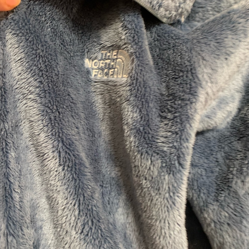 Woman’s aqua blue jacket